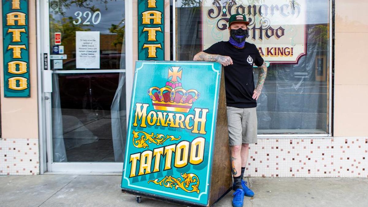 Tattoo artist Kody Flannery stands outside of Monarch Tattoo in Kennewick, where he's worked for 10 years and owned since 2018.