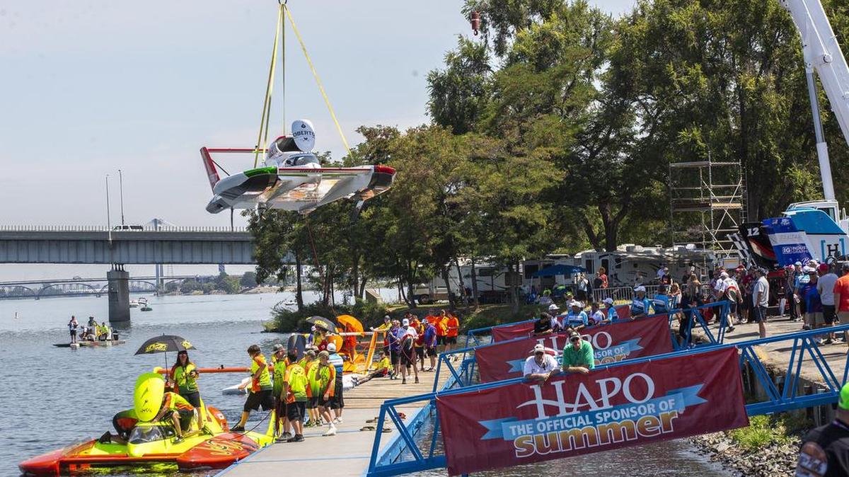 Crews with the H1 Unlimited Hydroplanes get their boats in the water by the docks and prepare to compete in the HAPO Columbia Cup during Water Follies at Columbia Park in Kennewick