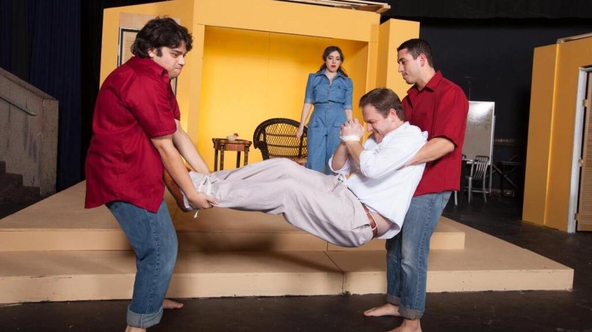 Columbia Basin College’s production of “The Night of the Iguana” opens Feb. 11 in Pasco. Peter Adams, in the white shirt, plays a troubled former minister staying at a small Mexico hotel. Ricardo Orta and Chris Garcia, left to right in red shirts, play hotel workers. Christy Valle, who plays hotel owner Maxine, looks on.