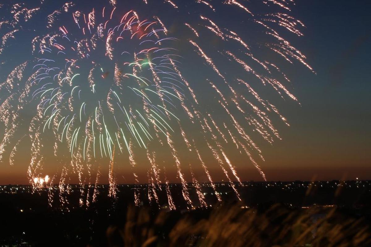Fireworks sparkle in the sky above the Columbia River during celebrations on the Fourth of July in Kennewick.