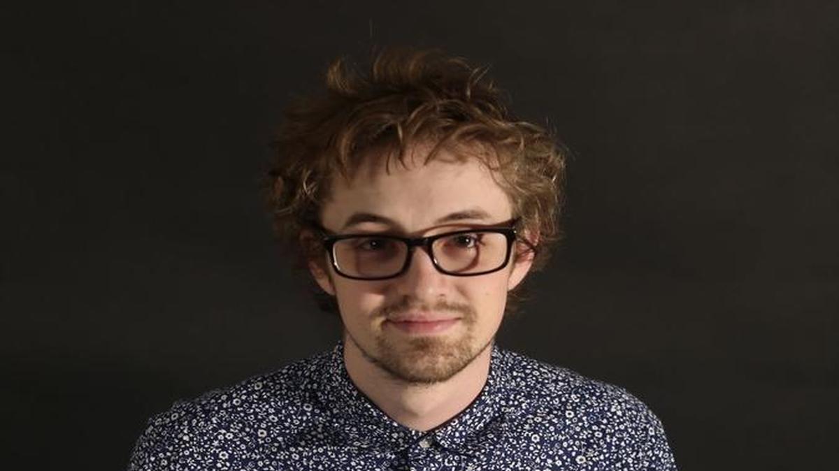 Richland artist Kyson Cartwright poses with some of his computer artwork. Self-taught, he draws under the name Bone.Fork, and his work can frequently be seen on local event posters, music videos and more.