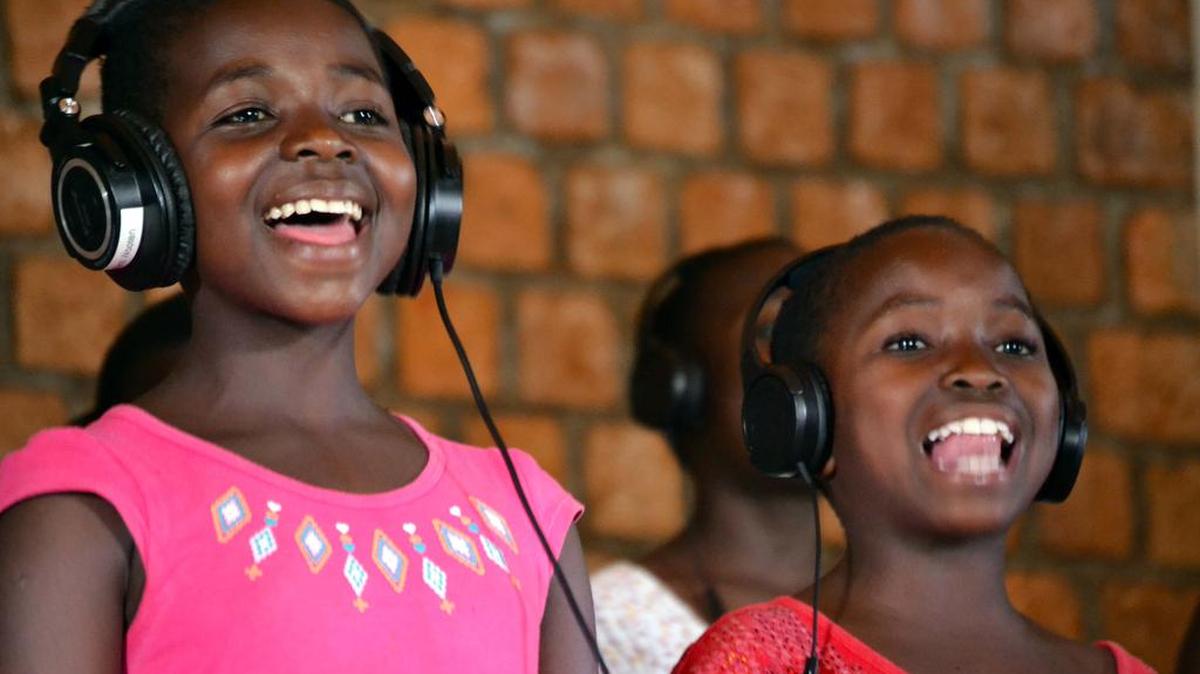 Members of the African Children’s Choir record new music in a recent session.