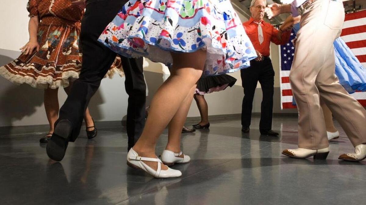 Legs of couples square dancing
