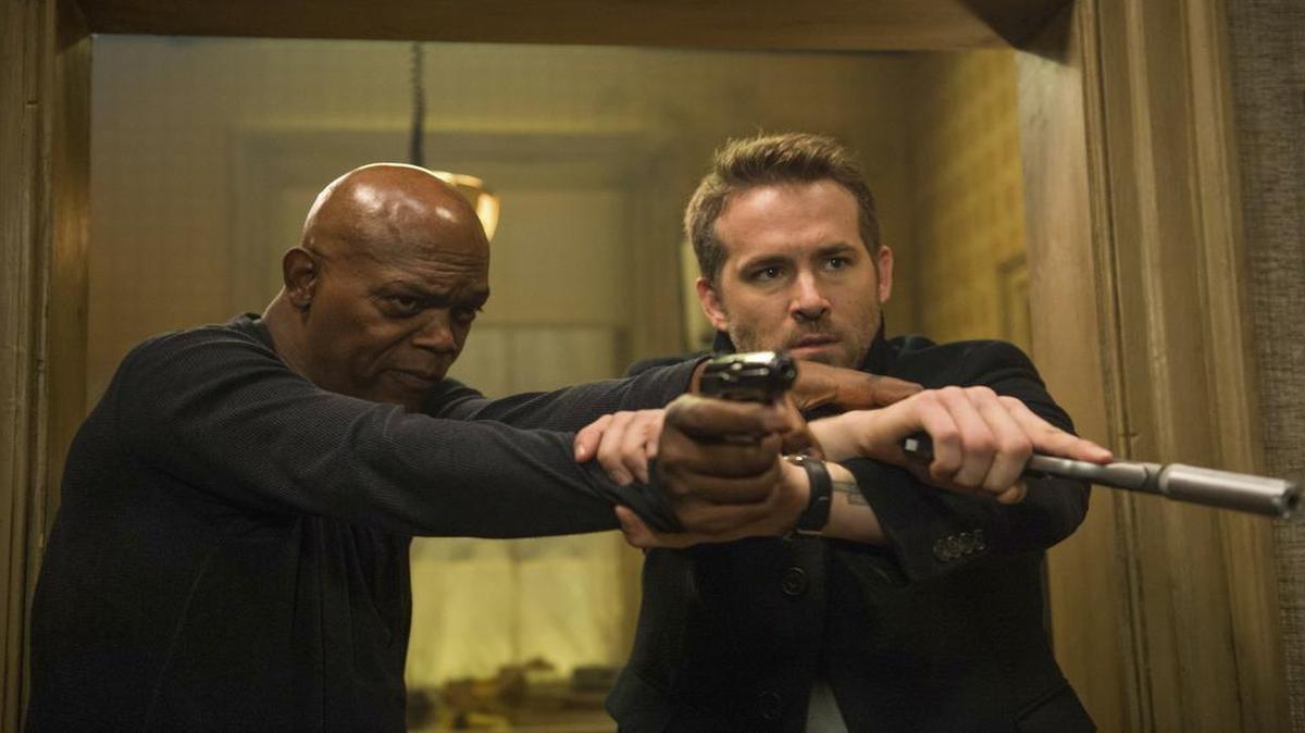Samuel L. Jackson, left, and Ryan Reynolds are featured in Lionsgate’s “The Hitman’s Bodyguard.”