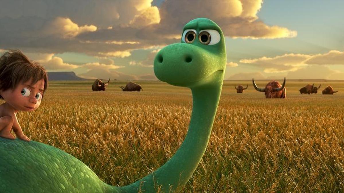 Spot, voiced by Jack Bright, left, and Arlo, voiced by Raymond Ochoa, in a scene from The Good Dinosaur.
