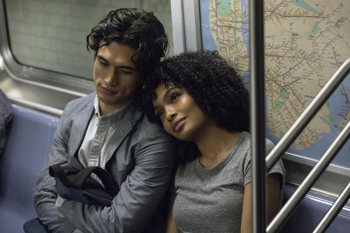 In this image released by Warner Bros. Pictures, Charles Melton, left, and Yara Shahidi appear in a scene from the film “The Sun Is Also a Star.”