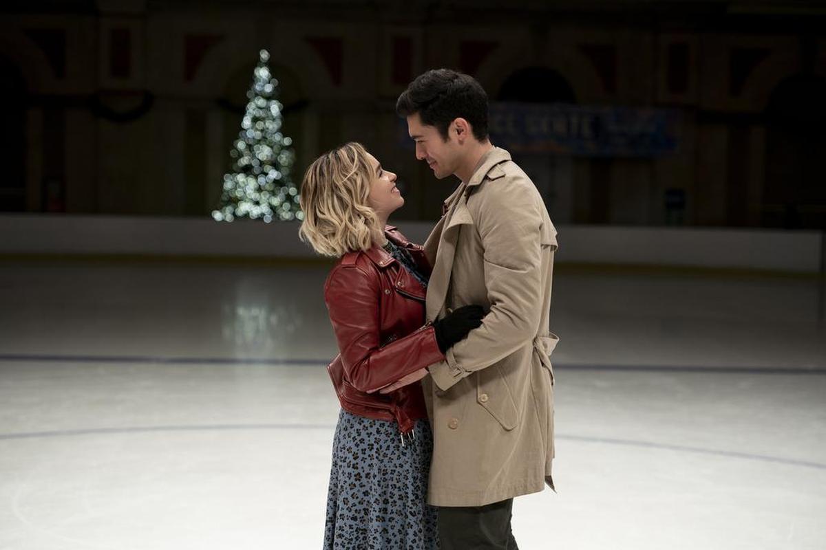 This image released by Universal Pictures shows Emilia Clarke, left, and Henry Golding in a scene from "Last Christmas."