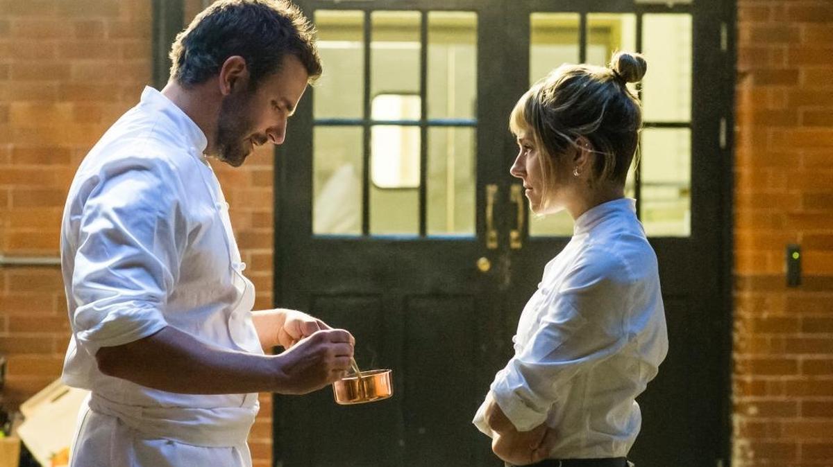 Bradley Cooper plays Adam Jones and Sienna Miller plays Helene in Burnt.