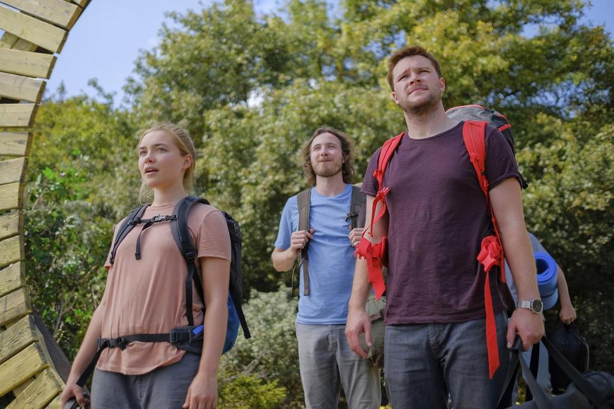 Jack Reynor, right, and Florence Pugh in a scene from the horror film "Midsommar."