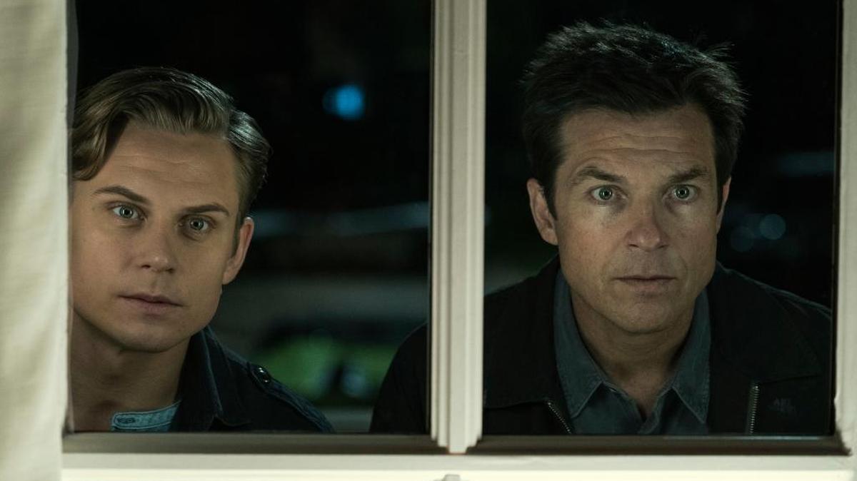 Billy Magnussen, left, and Jason Bateman in a scene from "Game Night." The film also stars Rachel McAdams and is a winner thanks in large part to Bateman being ... well ... Bateman.
