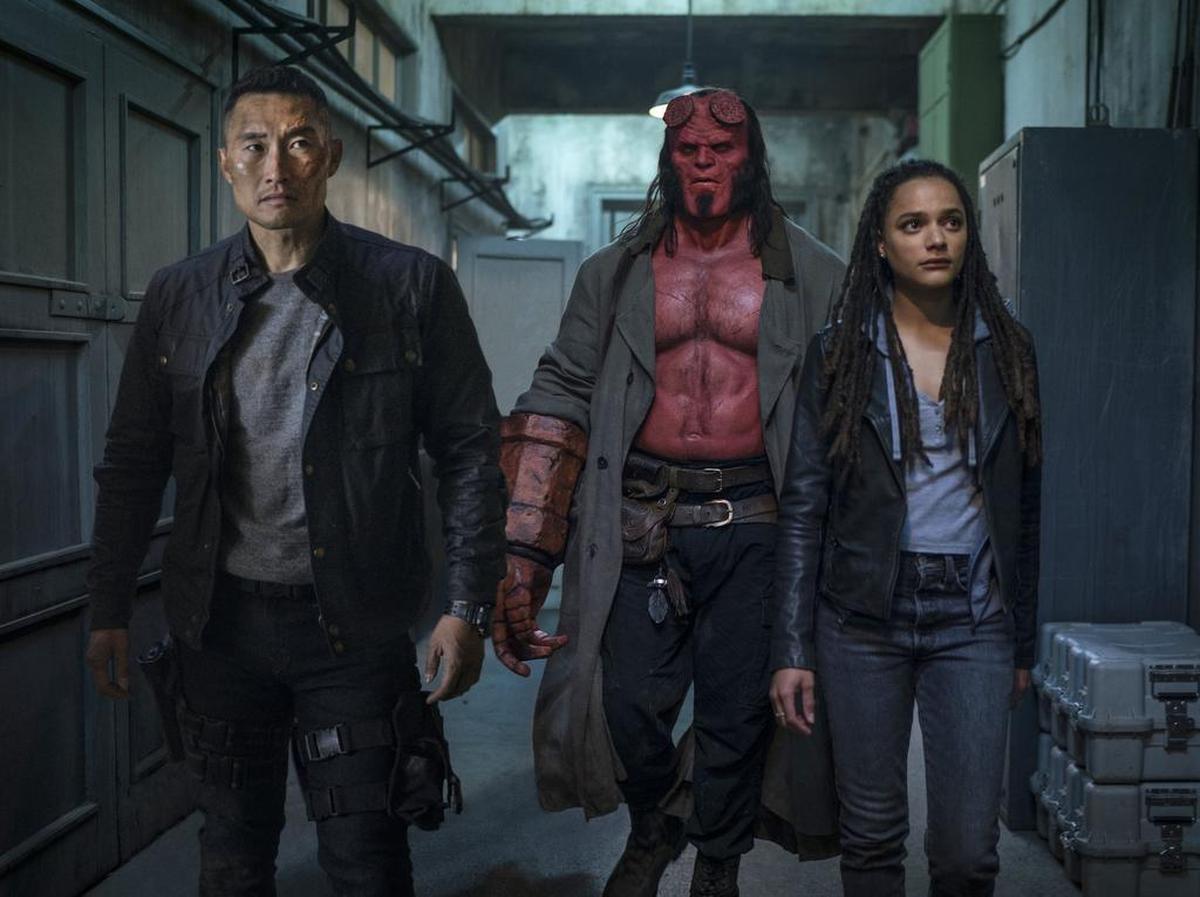 This image released by Lionsgate shows, from left, Daniel Dae Kim, David Harbour and Sasha Lane in a scene from "Hellboy."
