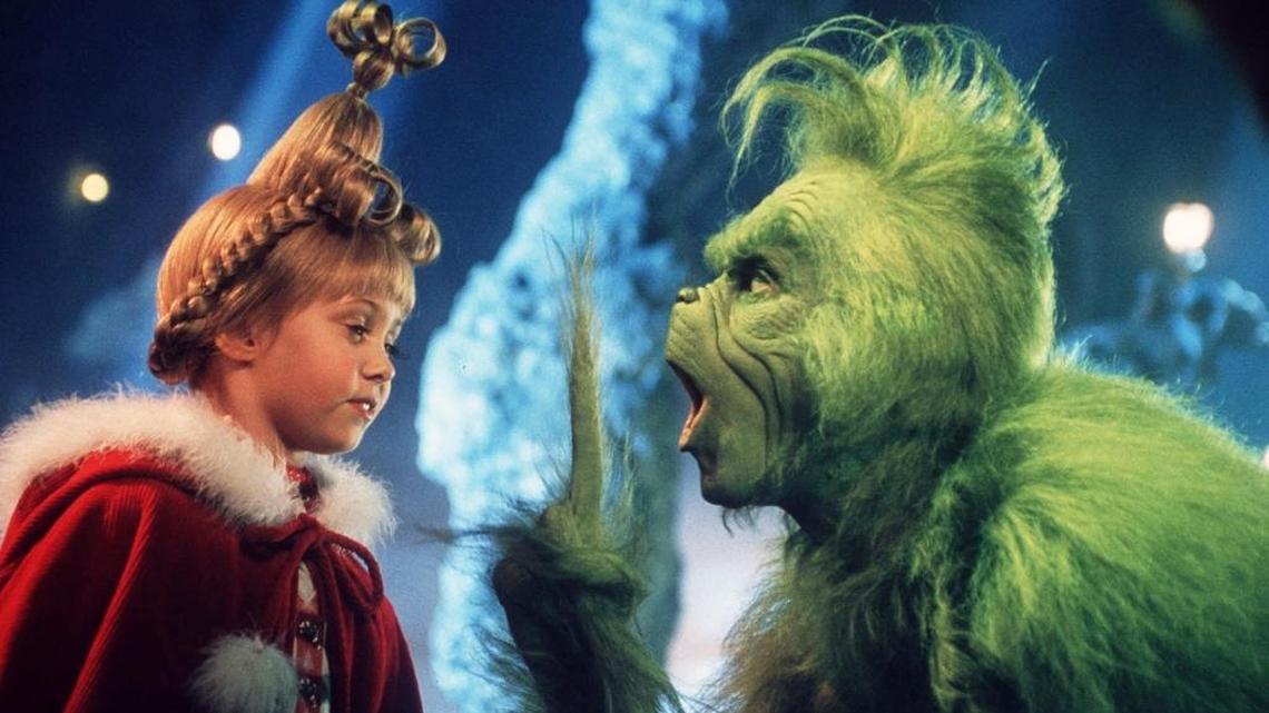 Child actress Taylor Momsen as Cindy Lou Who, left, shares a scene with the Grinch, played by Jim Carrey, in a scene from “Dr. Seuss’ How The Grinch Stole Christmas,” a live-action release in 2000 of the classic story.