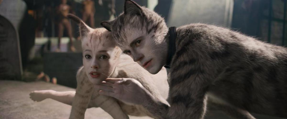 Francesca Hayward as Victoria, left, and Robbie Fairchild as Munkustrap in a scene from “Cats.”