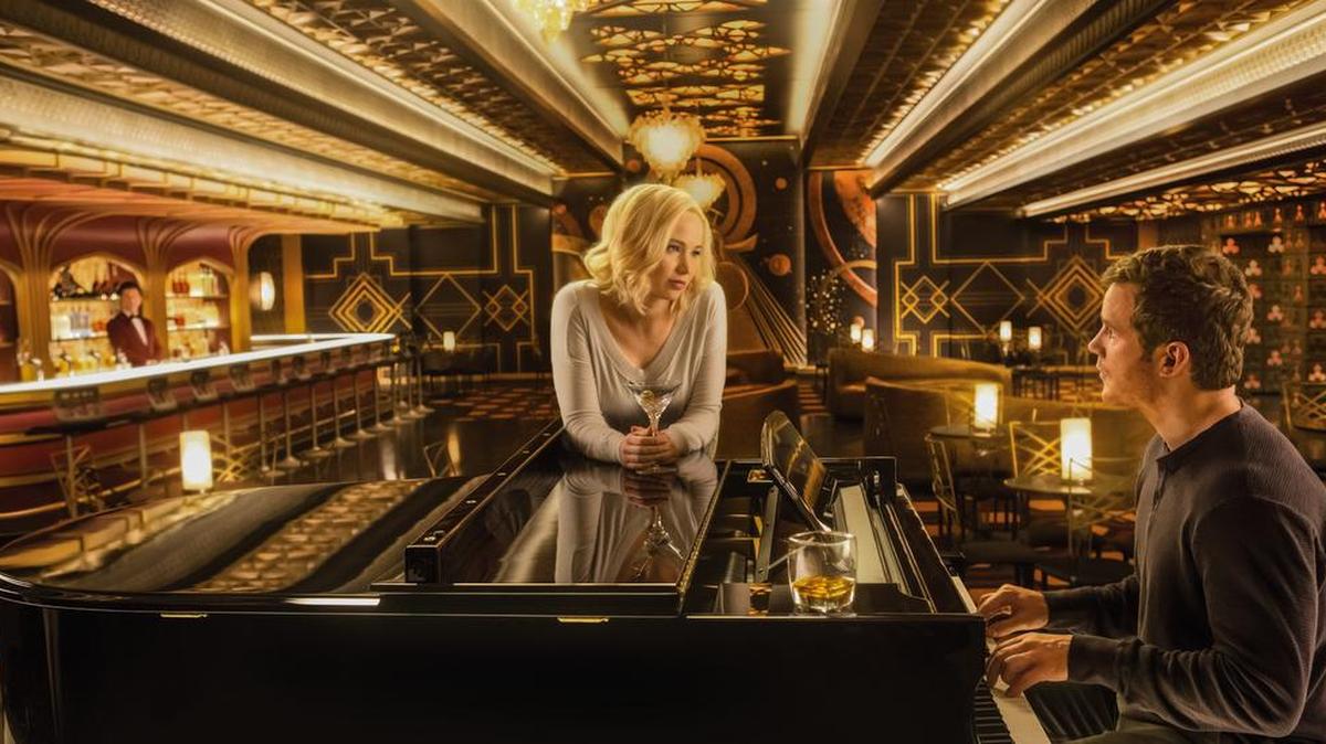Jennifer Lawrence, center, Chris Pratt, right, and Michael Sheen in the film Passengers.