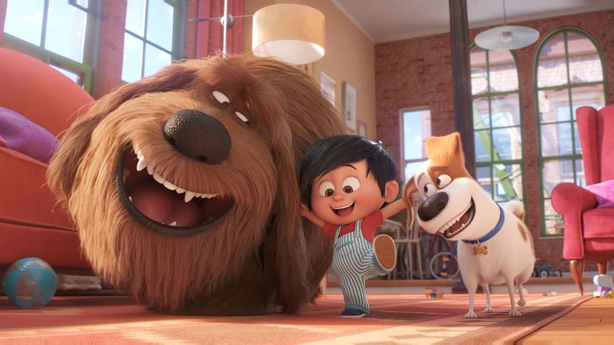 This image released by Universal Pictures shows, from left, Duke, voiced by Eric Stonestreet, Liam, voiced by Henry Lynch and Max, voiced by Patton Oswalt in a scene from "The Secret Life of Pets 2."