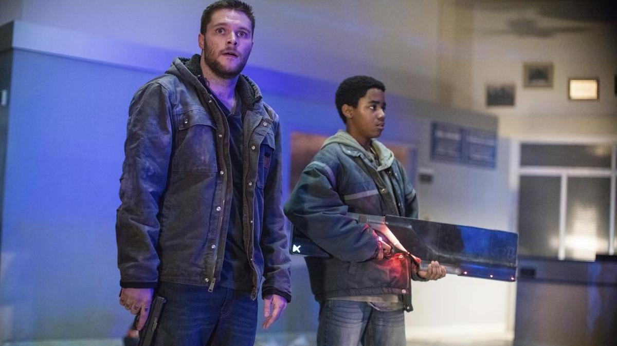 Jack Reynor, left, and Myles Truitt in a scene from “Kin.” It’s a science fiction flick where the science fiction gets in the way of a good movie.