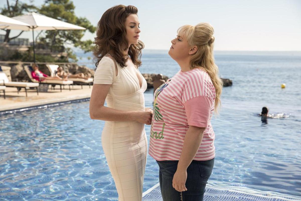 This image released by Metro-Goldwyn-Mayer Pictures shows Anne Hathaway as Josephine Chesterfield, left, and Rebel Wilson as Penny Rust, in a scene from "The Hustle."