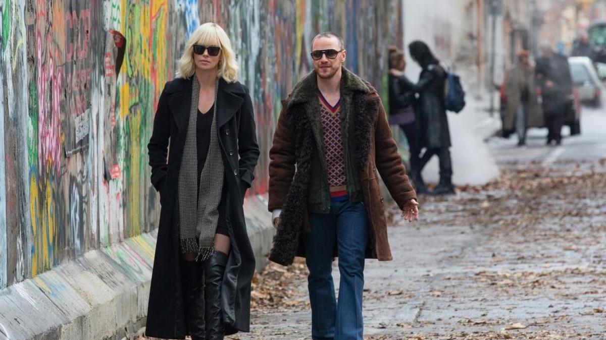 Charlize Theron, left, and James McAvoy star in “Atomic Blonde.”