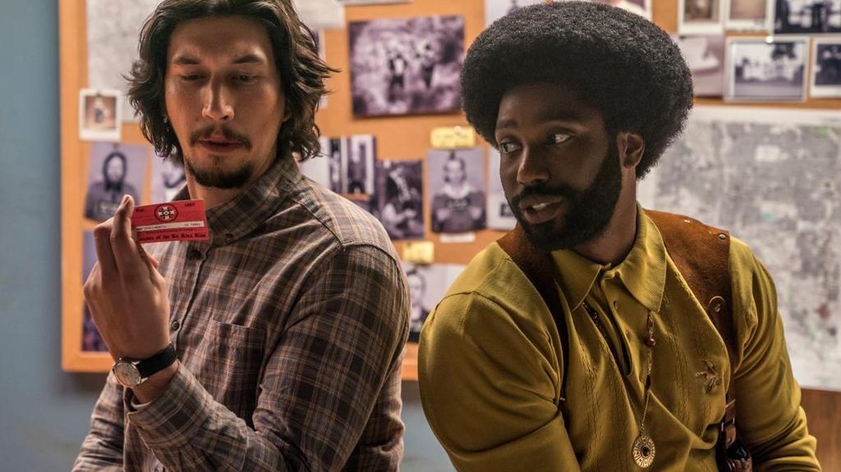 This image released by Focus Features shows Adam Driver, left, and  John David Washington in a scene from “BlacKkKlansman.” (David Lee/Focus Features via AP)
