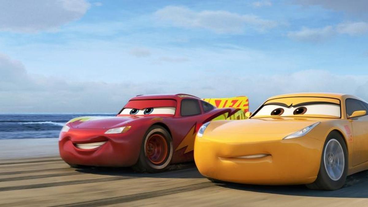 This image released by Disney shows Lightning McQueen, voiced by Owen Wilson, left, and Cruz Ramirez, voiced by Cristela Alonzo in a scene from "Cars 3."