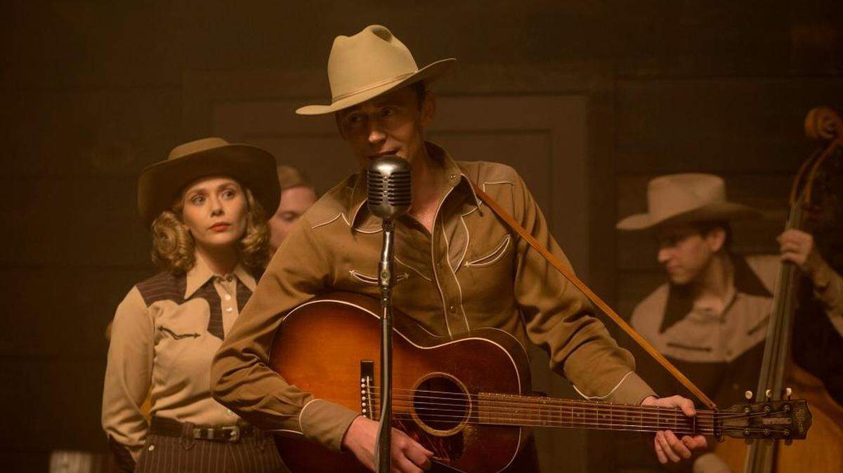 Elizabeth Olsen plays Audrey Williams and Tom Hiddleston plays Hank Williams in “I Saw the Light.”