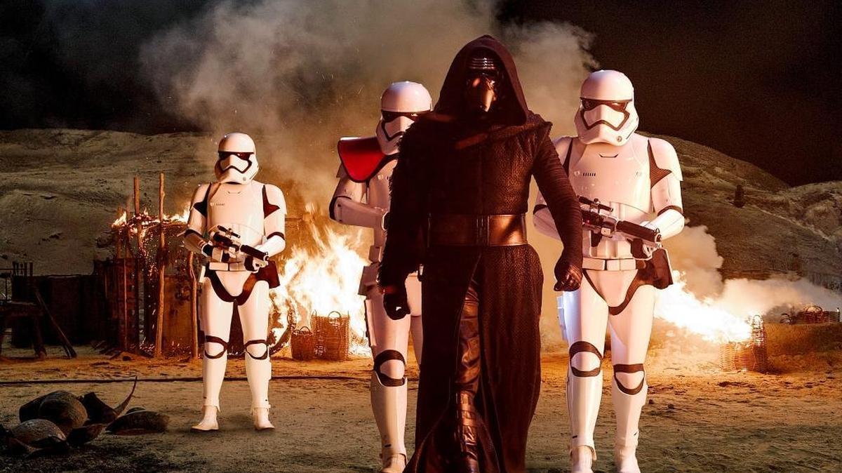 Kylo Ren (Adam Driver) with Stormtroopers in “Star Wars: The Force Awakens.”