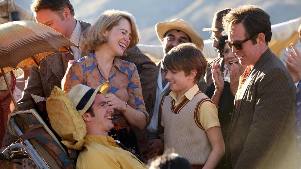 In “Breathe,“ Andrew Garfield, foreground, portrays the late disability advocate Robin Cavendish with, from left, actors Hugh Bonneville, Claire Foy, Harry Marcus and Tom Hollander.
