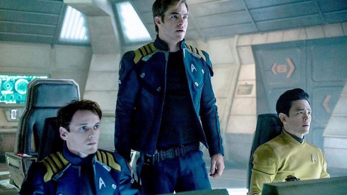 Anton Yelchin, from left, Chris Pine and John Cho appear in a scene from “Star Trek Beyond.”