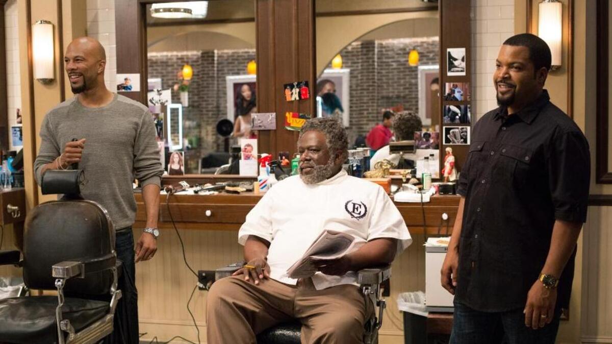 Common as Rashad, left to right, Cedric the Entertainer as Eddie and Ice Cube as Calvin in “Barbershop: The Next Cut.”