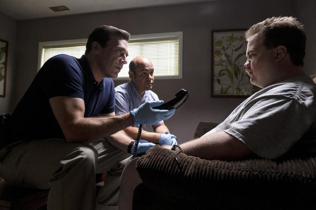 This image released by Warner Bros. Pictures shows Jon Hamm, left, and Paul Walter Hauser in a scene from "Richard Jewell."