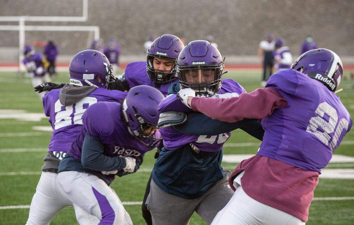The Pasco High School Bulldogs football team runs drills at Edgar Brown Memorial Stadium off of North 18th Ave. in Pasco for the upcoming abbreviated spring 2021 football season that begins Feb. 26.