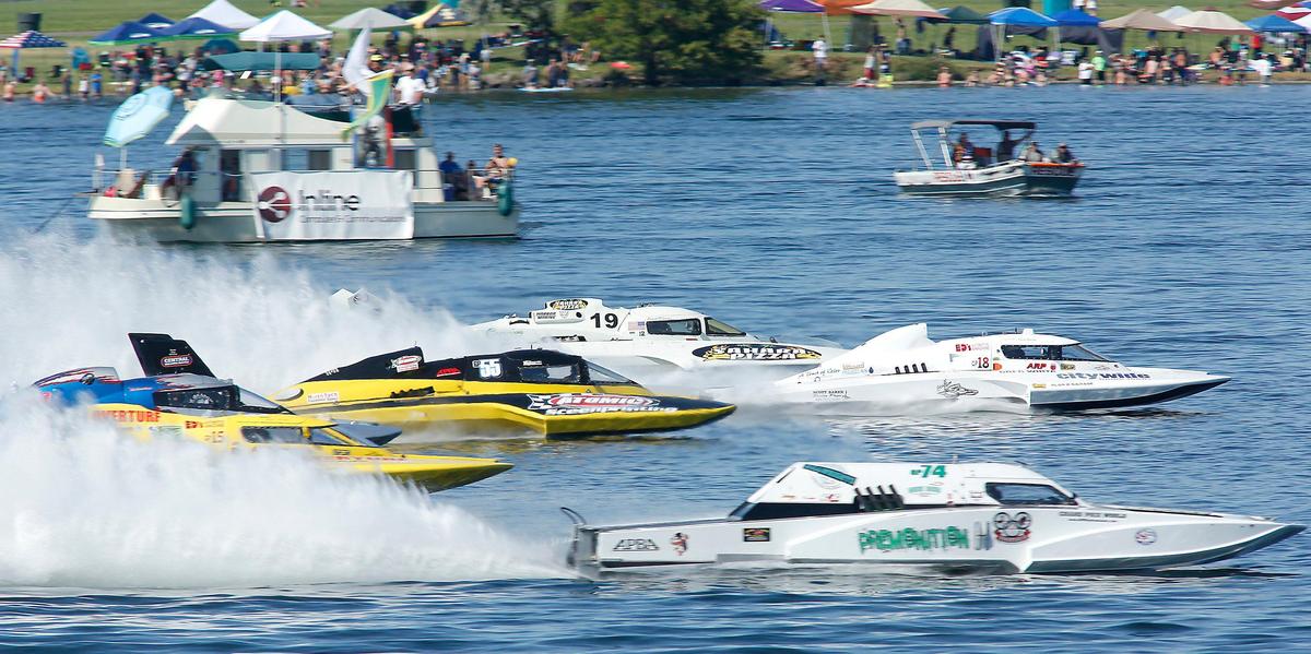 The pack of Grand Prix World Hydroplane Racing Association boats thunder across the starting line in a tight pack for their championship race Sunday on the Columbia River. Greg Hopp drove the yellow GP-15, far left, to victory.
