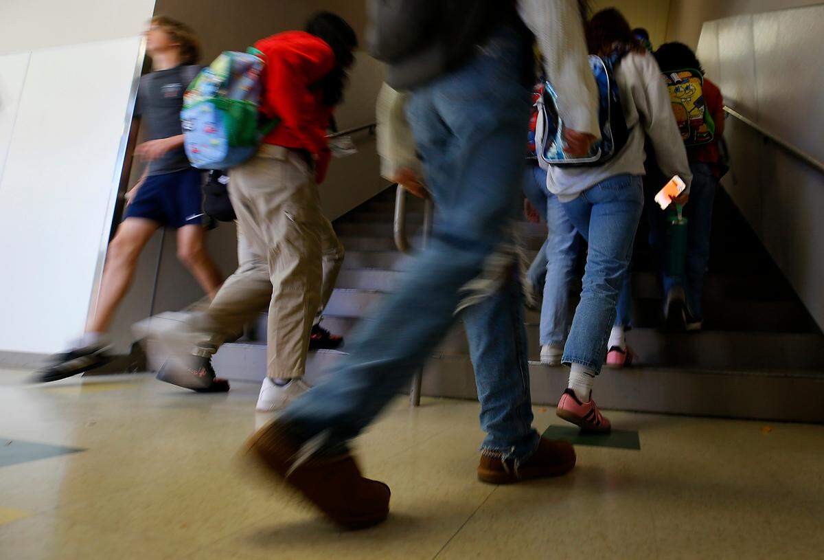 Richland High School students navigate congestion on the stairwell in Mac Hall, the building with math and science classrooms, during a scheduled class change.