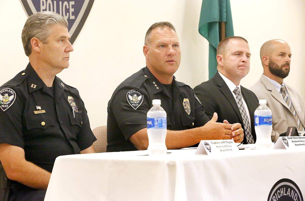 Former Richland Police Chief Chris Skinner, second from left, answers questions during a 2017 press conference about the the multi-agency law enforcement Operation Net Nanny child sex sting held in the Tri-Cities.