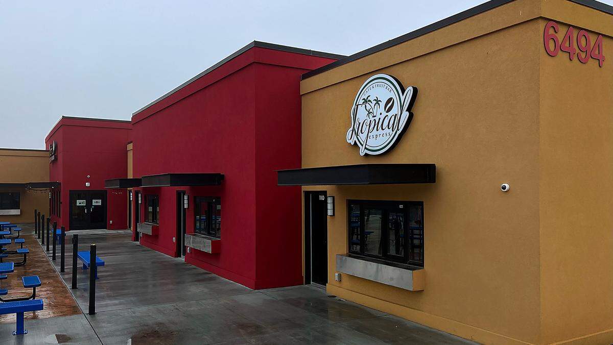 Sign for new Tropical Express Cafe & Fruit Bar at the 1derful Food Park between McDonald’s and Sportsman’s Warehouse by the Colonnade Shopping Center. in west Kennewick of West Canal Drive.