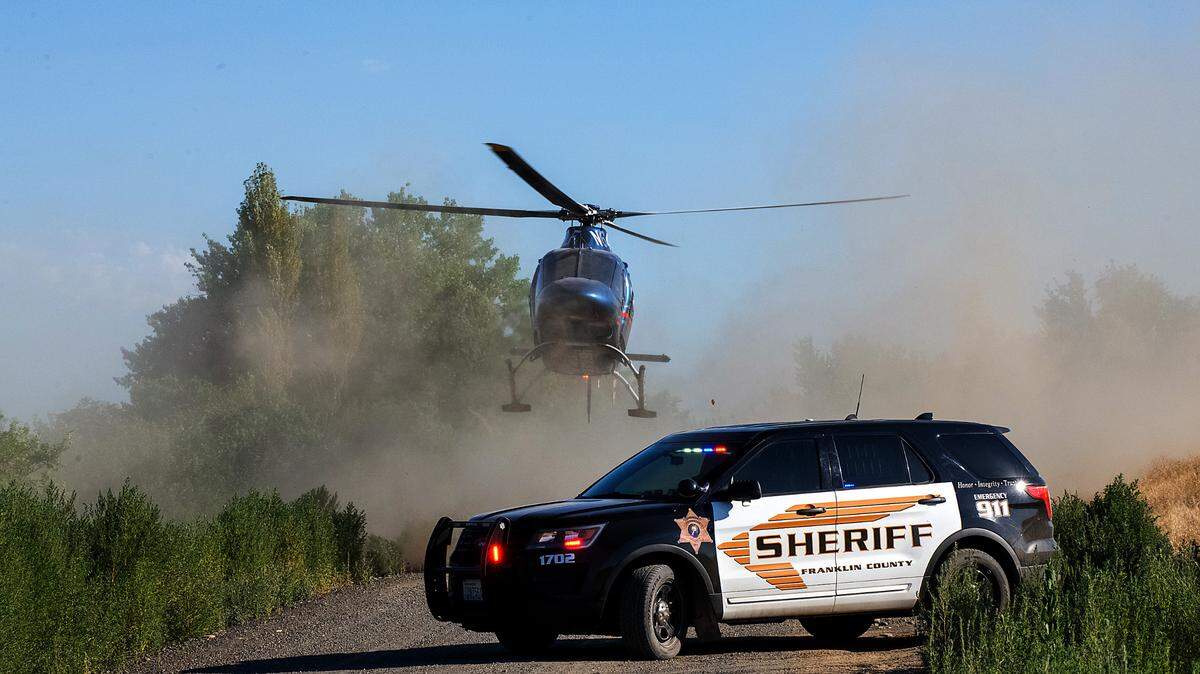 A Life Flight helicopter kicks up a cloud of dust after being dispatched to transport a critically injured woman ATV driver from a rural Franklin County orchard to a local hospital.