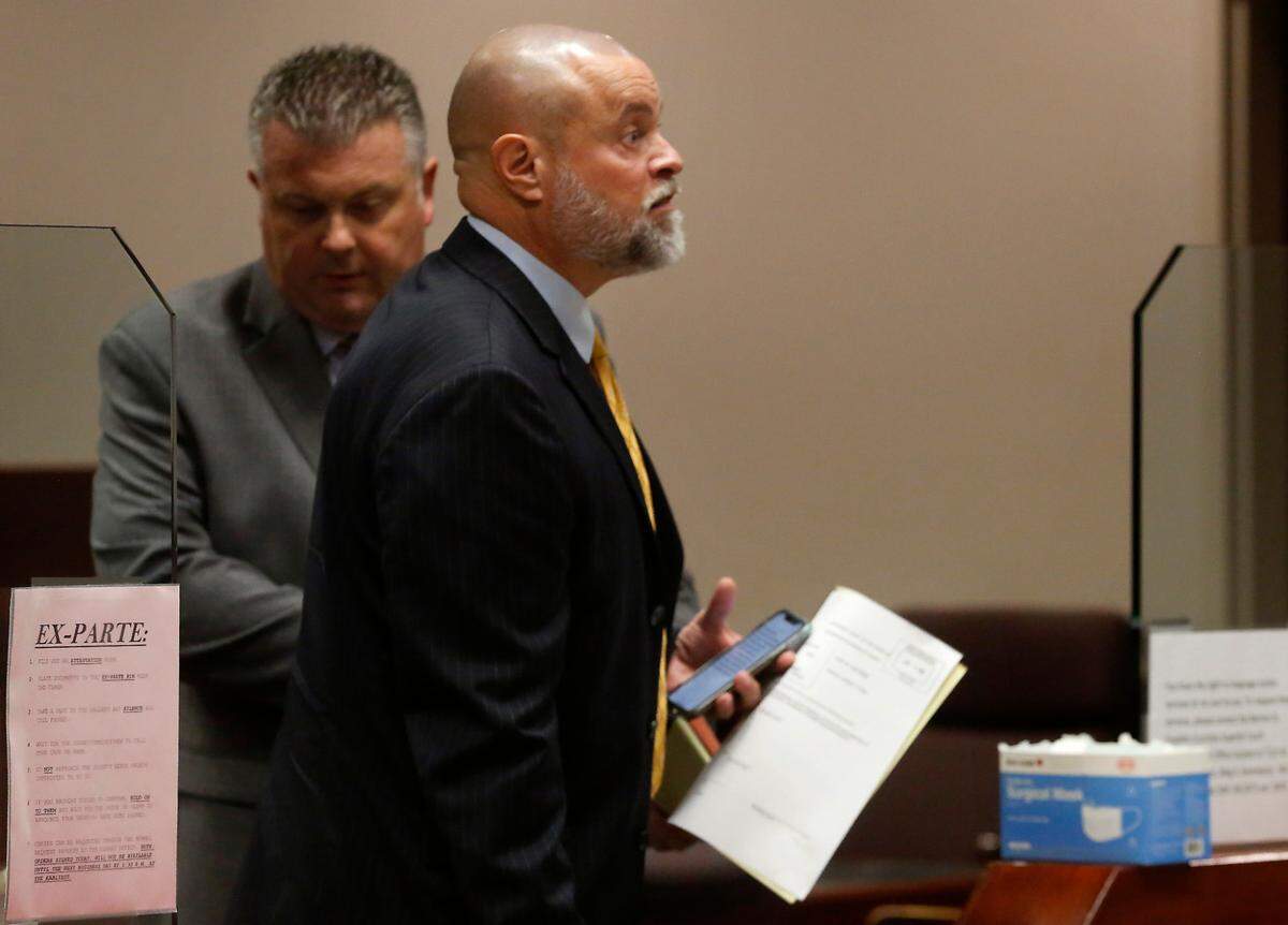 Judge Sam Swanberg, right, leaves a Franklin County courtroom with his defense attorney Scott Johnson after a jury acquitted him of domestic violence in 2022.