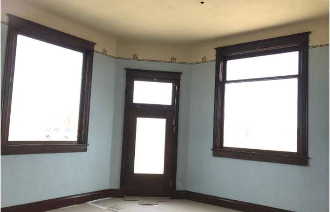 The interior walls of the White Bluffs Bank have been restored to their original blue with gold-colored trim at the top.