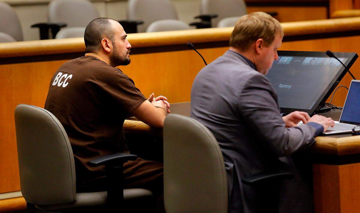 Murder suspect Richard Michael Jacobson, left, makes his preliminary appearance in Benton County Superior Court in Kennewick.