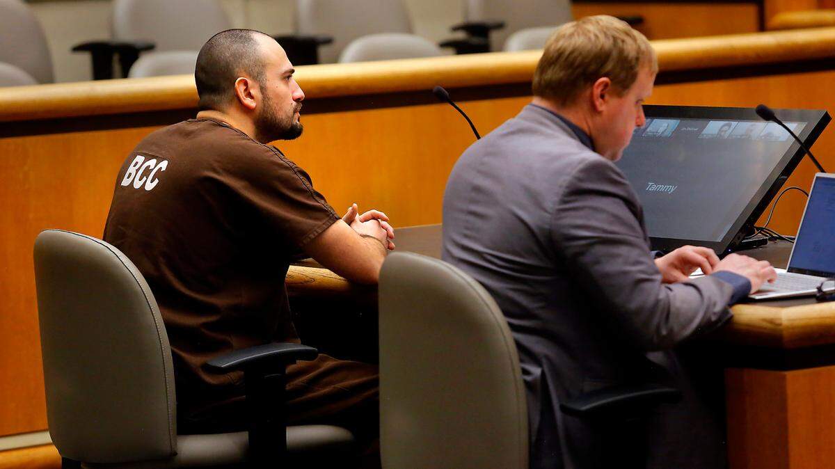 Murder suspect Richard Michael Jacobson, left, makes his preliminary appearance in Benton County Superior Court in Kennewick in 2023