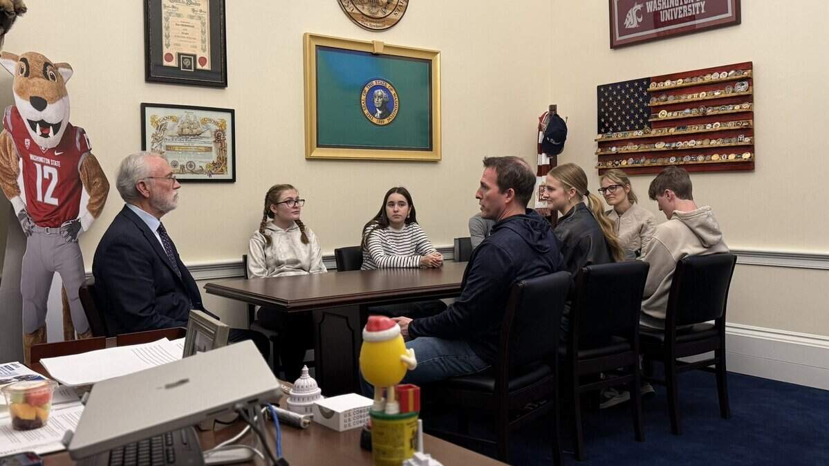 U.S. Rep. Dan Newhouse, far left, meets with Kennewick School Board member Josh Miller and his family on Wednesday to discuss the board’s sex discrimination complaint against Washington state, OSPI, and Superintendent Chris Reykdal.