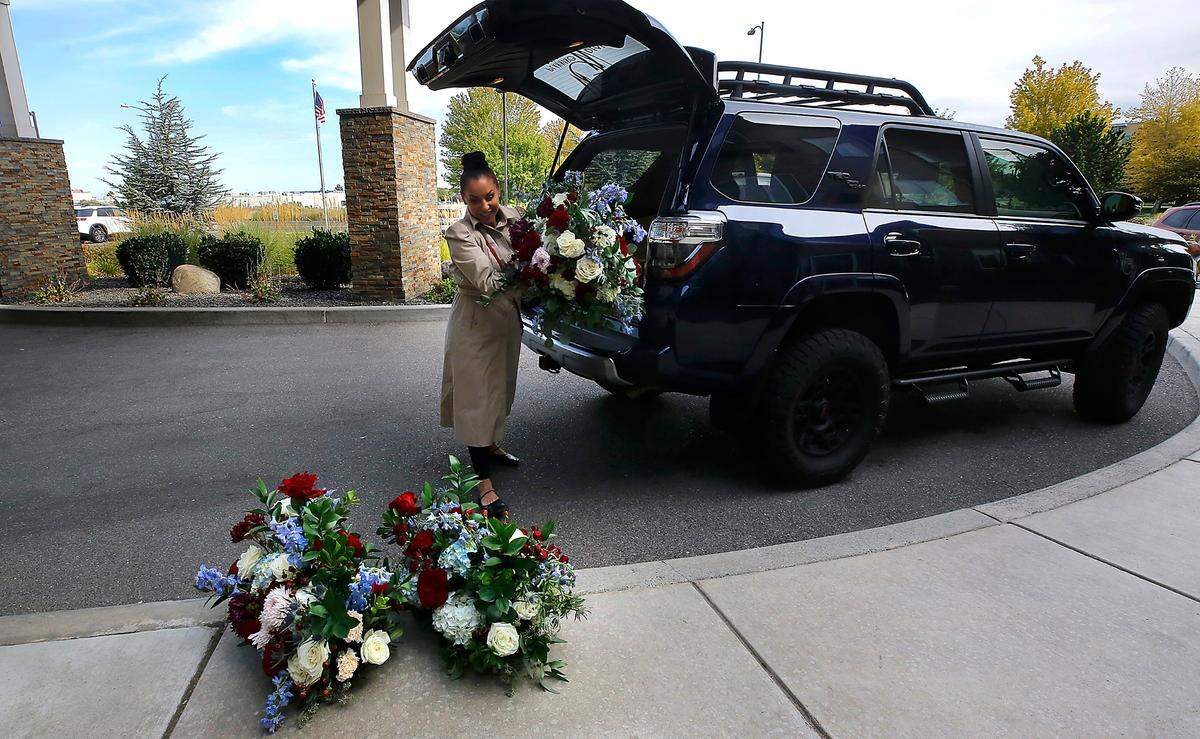 Alexandra RoseLee, owner of White Glove Weddings, delivers repurposed flower arrangements from a weekend wedding ceremony to Ciel Senior Living of Tri-Cities in Kennewick.