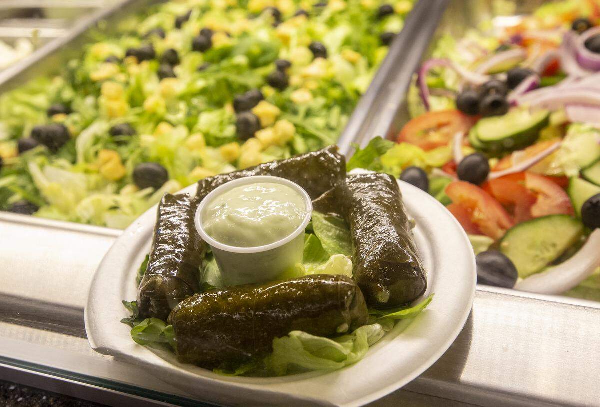 Dolmades is stuffred grape leaves with meat and spiced rice wrapped in vine or cabbage leaves.