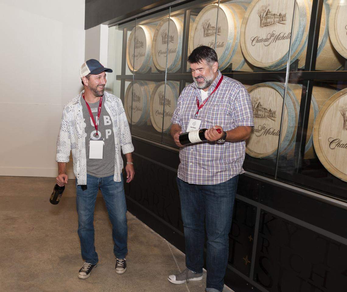 Trey Busch, left, and Mark McNeilly share a chuckle during the Auction of Washington Wines. They also team up on the popular and eclectic Underground Wine Project.