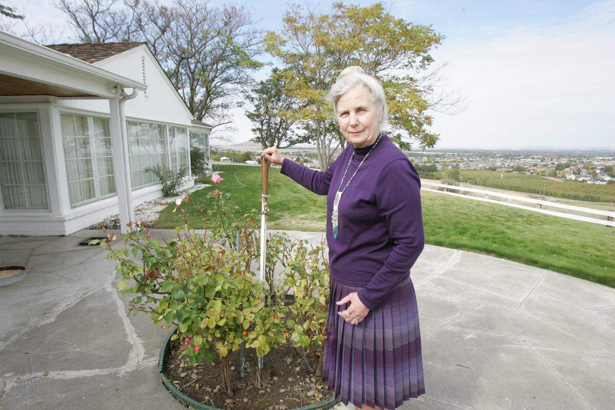 In this file photo from 2007, Sallie McMillin shows the house where she grew up. It was originally along the Columbia River west of the current Columbia Park Golf Course. After the 1948 flood, her father had the home moved in 1951 to the hill at the south end of Ely Street.