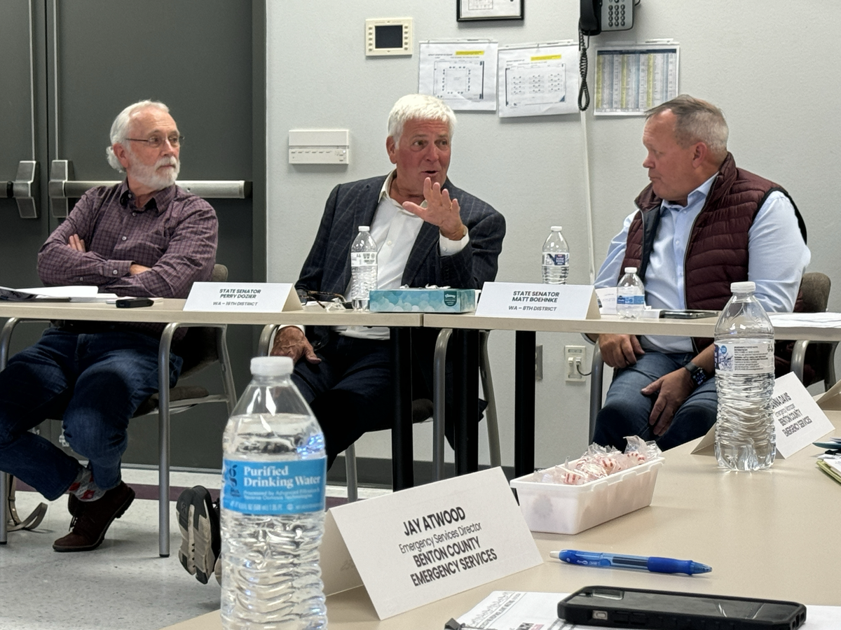 U.S. Rep. Dan Newhouse, R-Wash., listens as state Sen. Perry Dozier, R-Walla Walla, and state Sen. Matt Boehnke, R-Kennewick, discuss the continuing response to the Lineage cold storage warehouse fire and lessons learned.