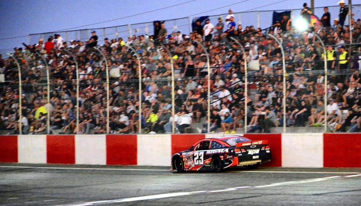 Greg Biffle makes contact with the wall at the Tri-City Raceway at Red Mountain Event Center in West Richland.