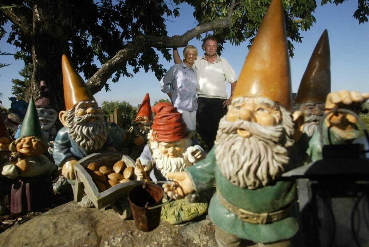 Sharon and Jim Watts were pictured in August 2005 with some of the 43 unique garden gnomes they had collected and placed around their Richland property.