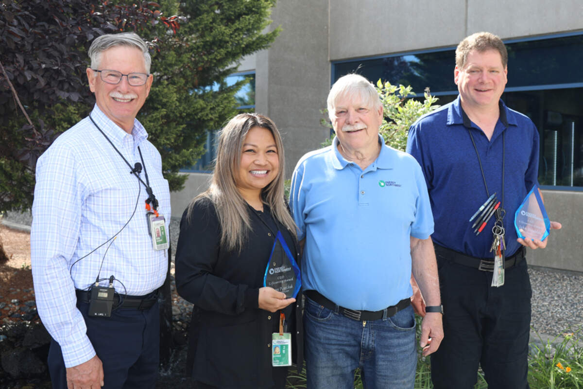 Energy Northwest CEO Bob Schuetz (far left) gave his CEO Lifesaving Award to Danee Pisarchuk and John Hagfeldt, far right, along with Steve Short, not pictured. They saved the life of Bob Powell, shown between Pisarchuk and Hagfeldt.