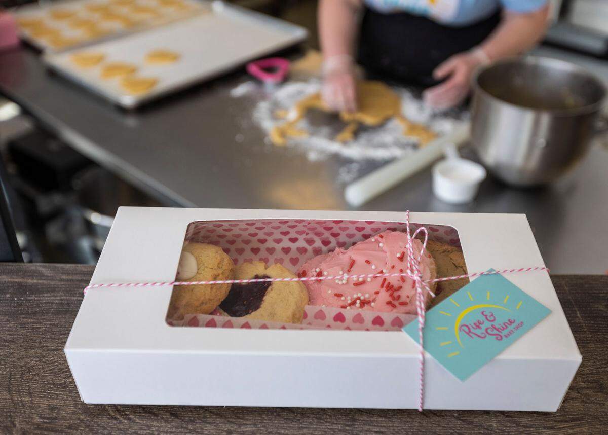 Annelee Giese of Rise & Shine Bake Shop in downtown Kennewick prepares heart-shaped sugar cookies for a Valentine’s and Super Bowl pop-up market at Red Mountain Commerical Kitchen. In addition to the bake shop, vendors will include European Desserts & Appetizers by Nena and Wild Olives Charcuterie Kingdom.